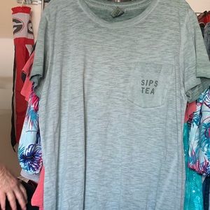 Pink shirt “sips tea”